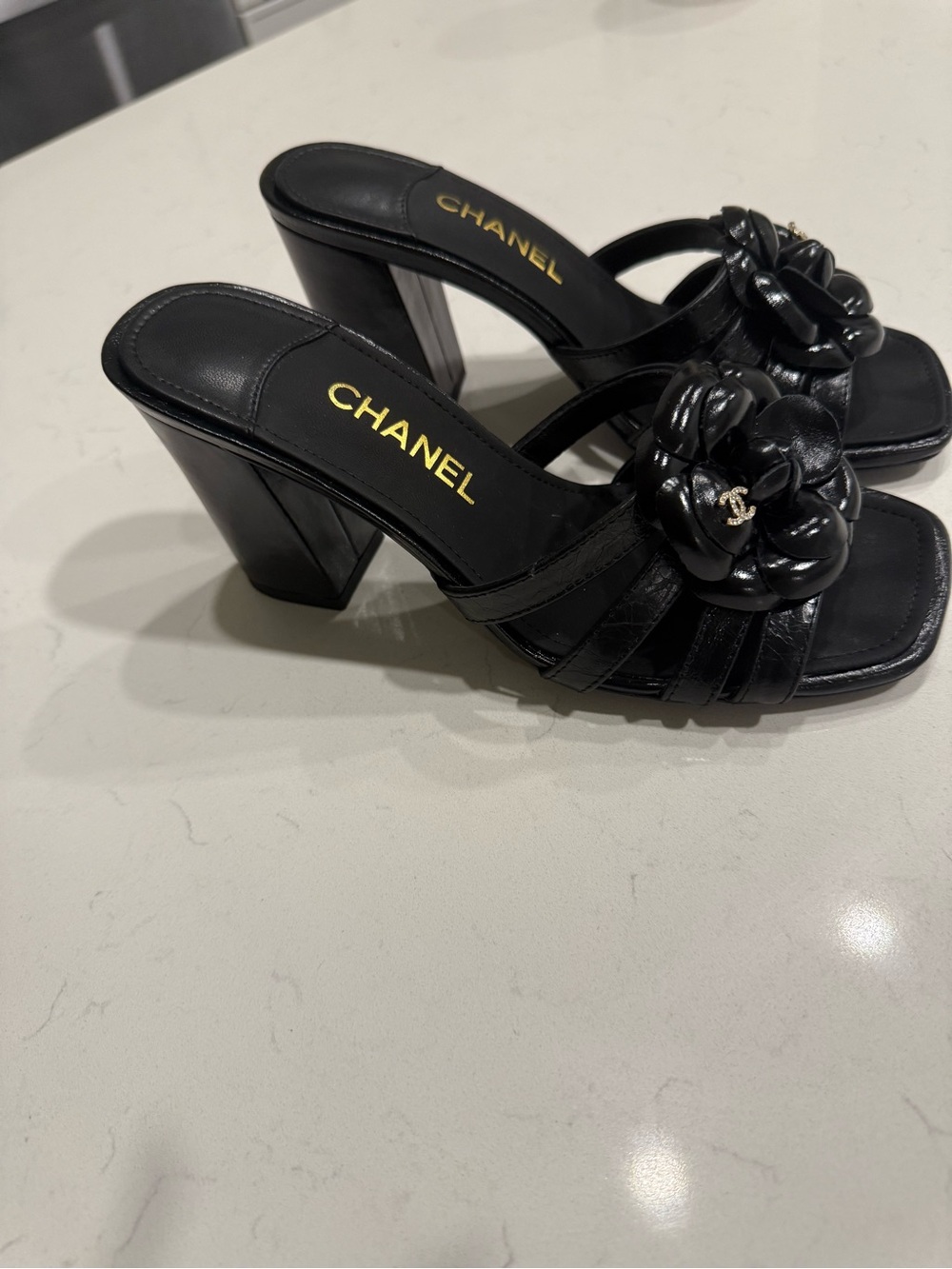 CHANEL Black Leather Camellia Slide Mules - Picture 1 of 6